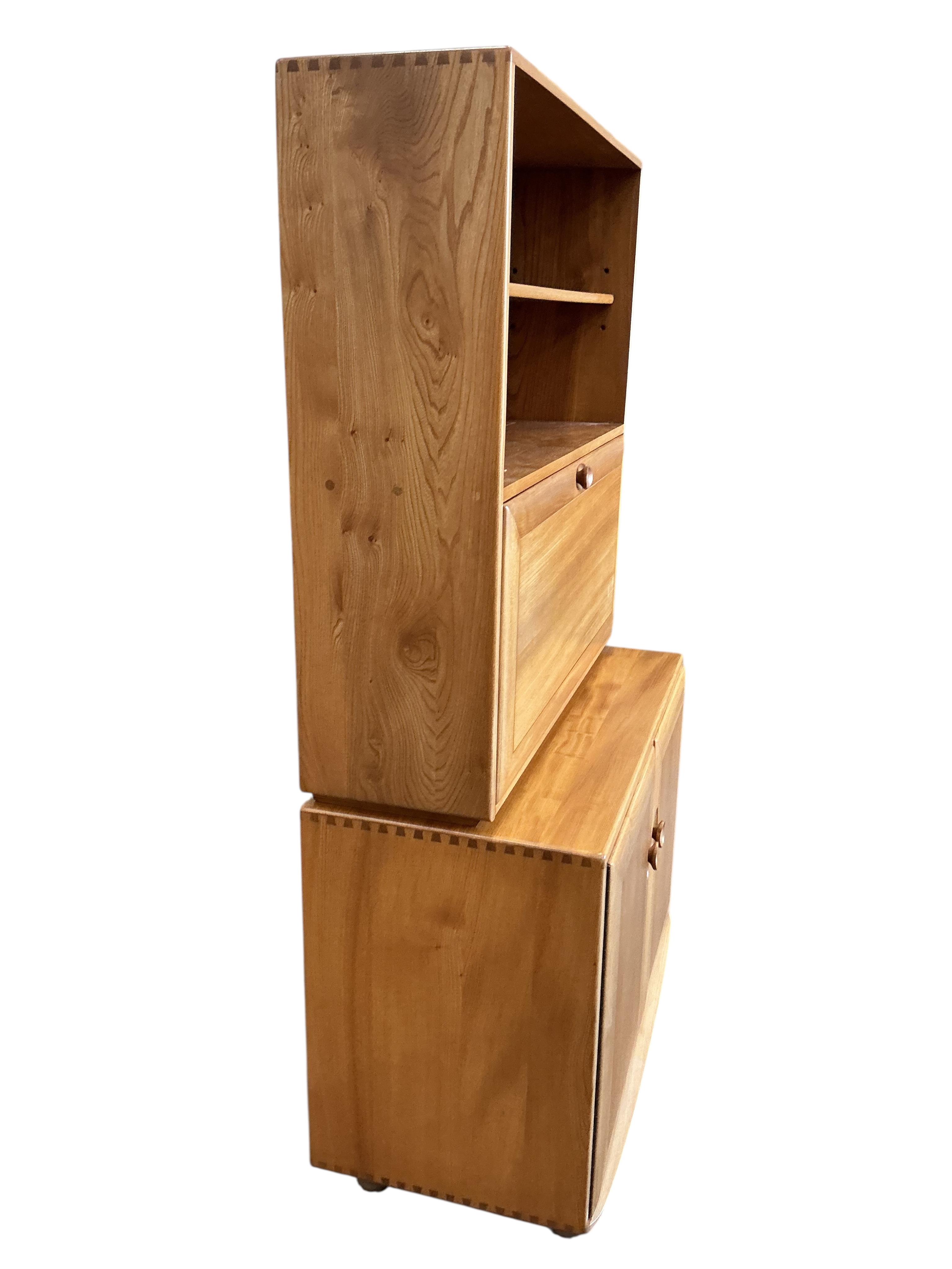 An Ercol Windsor light elm writing cabinet, width 91cm, depth 45cm, height 163cm